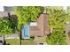 Aerial view of the home showcasing the pool and backyard with mature trees at 1711 Tierra Alta Dr, Lakeland, FL 33813