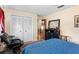 Bedroom with closet, mirror, and blue quilt at 1711 Tierra Alta Dr, Lakeland, FL 33813