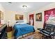 Bedroom featuring a comfortable blue quilt, sitting area, and window at 1711 Tierra Alta Dr, Lakeland, FL 33813