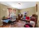 Bedroom with a neutral color scheme, a sewing machine on a desk, a round rug and a window at 1711 Tierra Alta Dr, Lakeland, FL 33813