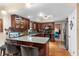 Well-appointed kitchen boasting stainless steel appliances, wood cabinets, and a convenient breakfast bar at 1711 Tierra Alta Dr, Lakeland, FL 33813