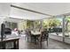 Enclosed lanai with tile flooring features a dining area and bar, great for entertaining guests at 1711 Tierra Alta Dr, Lakeland, FL 33813