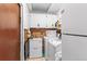Bright laundry room with a sink, washer, dryer, and storage cabinets at 1711 Tierra Alta Dr, Lakeland, FL 33813