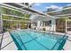 Inviting pool area with screened enclosure offers a refreshing escape from the sun at 1711 Tierra Alta Dr, Lakeland, FL 33813