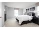 Comfortable bedroom featuring neutral walls, plush carpeting, a cozy bed, and a window with stylish window treatment at 3034 Cayey Way, Clermont, FL 34711