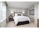 Cozy bedroom featuring a queen bed with a decorative headboard and two matching bedside tables at 3034 Cayey Way, Clermont, FL 34711