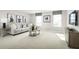 Cozy bonus room features neutral walls, plush carpeting, stylish furniture, and abundant natural light from large windows at 3034 Cayey Way, Clermont, FL 34711