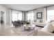 Comfortable living room showcasing neutral tones, stylish seating, and natural light at 3034 Cayey Way, Clermont, FL 34711