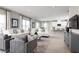 Open-concept living space with modern furniture, bright lighting, and stylish décor at 3034 Cayey Way, Clermont, FL 34711