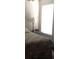 Comfortable bedroom with a side table and digital alarm clock for convenience at 3850 Plantation Blvd, Leesburg, FL 34748