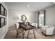 Serene home office featuring a stylish desk, comfortable seating, and soft lighting for productivity at 415 Harvard Ct, Dundee, FL 33838