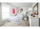 Charming bedroom features a cozy bed, whimsical decor, and plenty of natural light at 744 Cantaberry Dr, Dundee, FL 33838