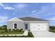 Charming single-story home with a gray exterior, a two-car garage, and neatly landscaped front yard at 744 Cantaberry Dr, Dundee, FL 33838