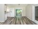 Modern kitchen with white cabinets, new floors, and plenty of natural light at 910 Nw 56Th Ave, Ocala, FL 34482