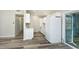 Modern kitchen featuring white cabinets, new floors and stainless refrigerator at 910 Nw 56Th Ave, Ocala, FL 34482