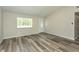 Bright, open-concept living room with new floors and lots of natural light at 910 Nw 56Th Ave, Ocala, FL 34482