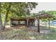 A backyard shed featuring a covered, caged area, offering a versatile storage solution at 910 Nw 56Th Ave, Ocala, FL 34482