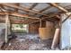 Interior view of a shed, displaying its simple frame construction with aged wooden beams at 910 Nw 56Th Ave, Ocala, FL 34482