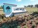 Welcoming community entrance sign with landscaping and decorative elements for Lake Nellie Crossing at 9836 Pine Mill Ct, Clermont, FL 34711