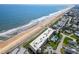 Aerial shot showcases a condo building with pool, near a beach, with ocean view at 2600 Ocean Shore Blvd # 111, Ormond Beach, FL 32176