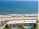 Overhead view of a beachfront condo building complex with a pool and ocean views at 2600 Ocean Shore Blvd # 111, Ormond Beach, FL 32176