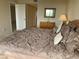 Inviting bedroom with a full-size bed and ample natural light at 2600 Ocean Shore Blvd # 111, Ormond Beach, FL 32176