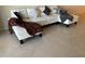 Living room with a white sectional couch and decorative pillows at 2600 Ocean Shore Blvd # 111, Ormond Beach, FL 32176