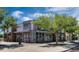 Commercial building featuring multiple windows, brick accents, and lush trees, creating a professional and inviting atmosphere at 3321 Grande Heron Dr, St Cloud, FL 34773