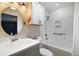This bathroom features a single vanity, toilet, and shower/tub combo at 7355 Se 106Th Pl, Belleview, FL 34420
