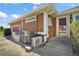 Exterior view of the property showing the AC unit, generator, and front entrance at 7355 Se 106Th Pl, Belleview, FL 34420