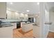 A large kitchen featuring sleek, black appliances and marble countertops at 7355 Se 106Th Pl, Belleview, FL 34420