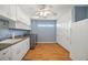 Functional laundry room with washer, dryer, sink, and lots of cabinet storage at 7355 Se 106Th Pl, Belleview, FL 34420
