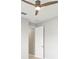 Bright room featuring a ceiling fan and doorway, offering modern comfort and style at 9262 Sw 102Nd Avenue Rd, Ocala, FL 34481
