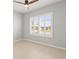 Sunlit bedroom features neutral walls, tiled floors and a window with plantation shutters at 9262 Sw 102Nd Avenue Rd, Ocala, FL 34481