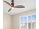 Bedroom features a decorative ceiling fan and plantation shutters for natural light control at 9262 Sw 102Nd Avenue Rd, Ocala, FL 34481