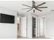 Bedroom with ceiling fan, a walk-in closet, tile flooring, and television at 9262 Sw 102Nd Avenue Rd, Ocala, FL 34481