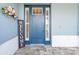 A welcoming entryway with a stylish blue front door and decorative welcome sign at 9262 Sw 102Nd Avenue Rd, Ocala, FL 34481