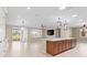An airy open concept living space with ample lighting and large island with seating at 9262 Sw 102Nd Avenue Rd, Ocala, FL 34481