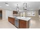 Large kitchen island, modern stainless steel appliances, and open layout at 9262 Sw 102Nd Avenue Rd, Ocala, FL 34481