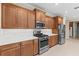 Modern kitchen featuring stainless steel appliances and wooden cabinets at 9262 Sw 102Nd Avenue Rd, Ocala, FL 34481