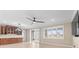 Spacious living room with tiled flooring, plantation shutters, and sleek ceiling fan at 9262 Sw 102Nd Avenue Rd, Ocala, FL 34481