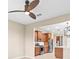 Open living area with modern fan, views into kitchen featuring stainless steel appliances at 9262 Sw 102Nd Avenue Rd, Ocala, FL 34481