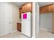 Pantry area with wood cabinets, a white refrigerator, and a doorway leading to another room at 9262 Sw 102Nd Avenue Rd, Ocala, FL 34481