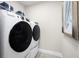 Bright and efficient laundry room with modern washer and dryer, ready for all your laundry needs at 1310 Whispering Ln, Minneola, FL 34715