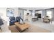 Open-concept living space connecting kitchen, dining, and living areas, with contemporary furnishings and decor at 1310 Whispering Ln, Minneola, FL 34715