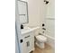 Recently remodeled bathroom with modern vanity, fixtures, and subway tile shower, for a spa-like experience at 232 Thomas Ave, Frostproof, FL 33843