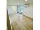 Bedroom featuring an air conditioner, wood floors, and a door to the backyard at 232 Thomas Ave, Frostproof, FL 33843