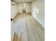 Bedroom featuring an air conditioner, wood floors, and an open doorway to another room at 232 Thomas Ave, Frostproof, FL 33843