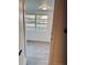 Bedroom featuring new floors and a large window with a scenic view at 232 Thomas Ave, Frostproof, FL 33843