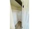 A closet with one shelf and rod and light hardwood floors at 232 Thomas Ave, Frostproof, FL 33843